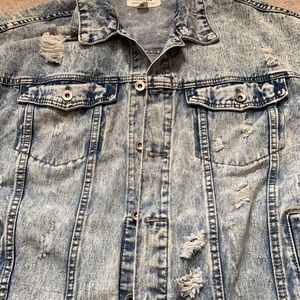 Blue Faded denim design. Two chest & side pockets. Ruggedly Ripped accents.